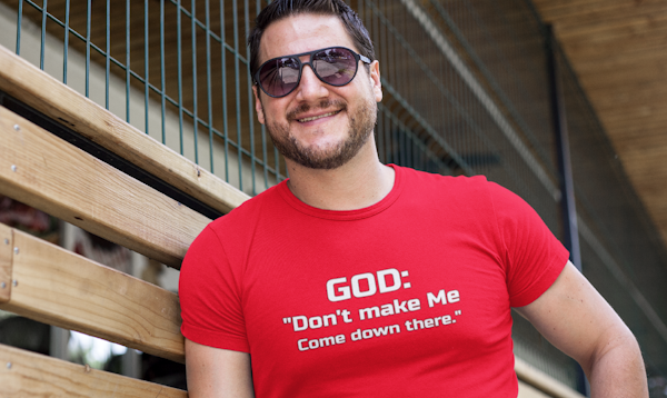 man wearing red tshirt with white lettering saying God: Don't make me come down there