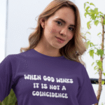 a woman in a purple shirt with When God Winks lettering